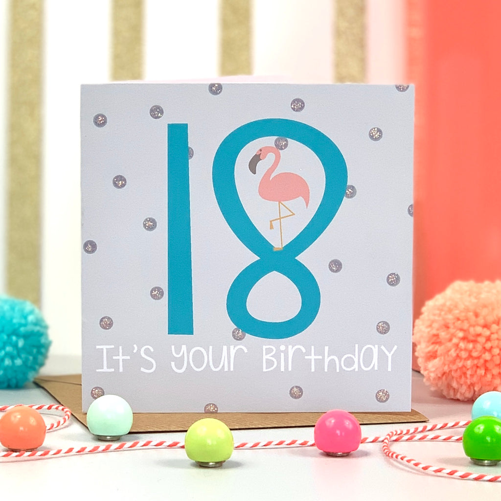 Happy 18th Birthday Card with polka dots and number 18 in blue with a cute flamingo standing on the 8 
